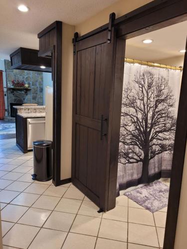 an open door in a kitchen with a tree at Little Womens Villa Condo 1 mile from Parkway in Gatlinburg
