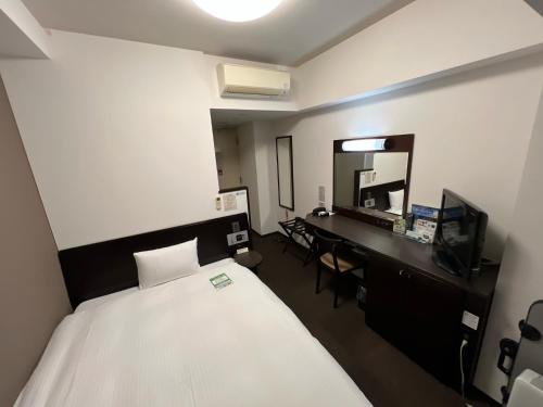 Cama o camas de una habitación en Hotel Route-Inn Uozu