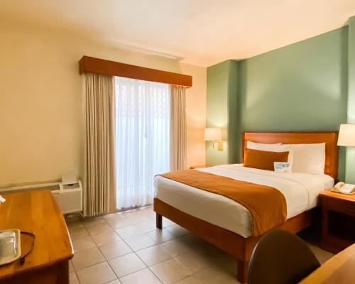 Ένα ή περισσότερα κρεβάτια σε δωμάτιο στο Comfort Inn Tampico