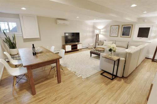 a living room with a couch and a table at Top of the Town - with Parking in Washington, D.C.