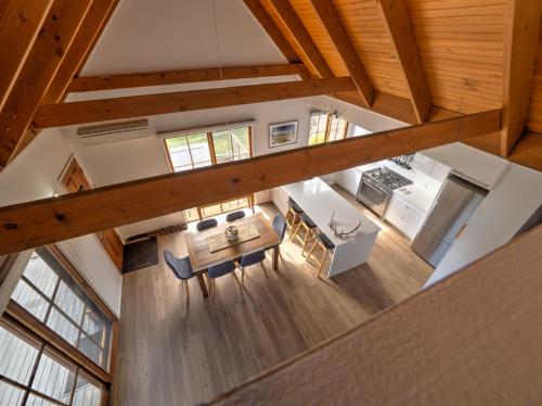 an overhead view of the kitchen and dining room of a house at Tulong LakEscape in Jindabyne