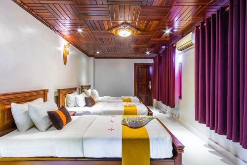 Postel nebo postele na pokoji v ubytování Hello Cambodia Boutique
