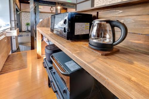 a toaster oven sitting on top of a counter at Epion 1 Good access to Kamikochi and Ukiyoe Museum, rent a Japanese Farm House in Matsumoto