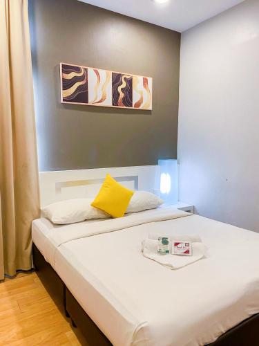 Postel nebo postele na pokoji v ubytování Lovita Hotel Kuantan