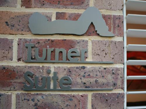a brick wall with a sign that reads lunch strike at Haven on the Park in Perth