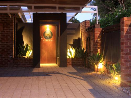 a front door of a house with a sign on it at Haven on the Park in Perth