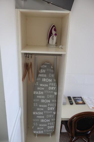 a book shelf in a room with a desk at Park Avenue Hotel Motel in Rockhampton