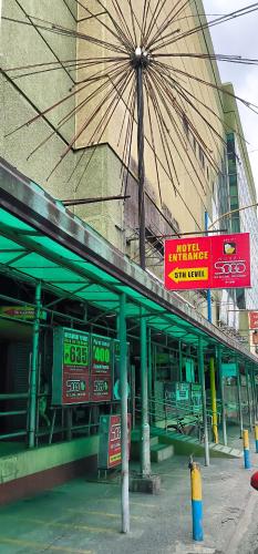 a building with signs on the side of it at Hotel Sogo Kalentong in Manila