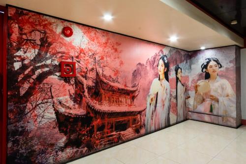 a large painting on a wall in a room at Hotel Sogo Kalentong in Manila