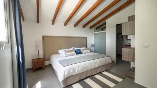 Postel nebo postele na pokoji v ubytování Le Gaetana Hotel
