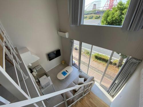 an overhead view of a bathroom with a large window at The land hotel L1 in Arao