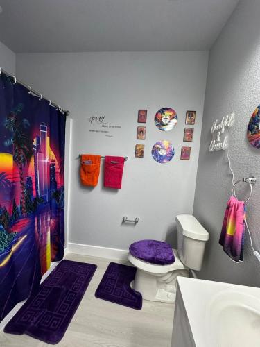 a bathroom with a purple toilet and a sink at Babyproofed, CinemaHome, TCU,DikciesArena,Stockyard,FortWorth in Fort Worth