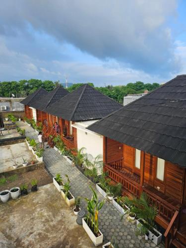 an overhead view of a row of houses with roofs at Amore in Labuan Bajo
