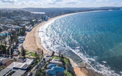 an aerial view of a beach and the ocean at Stunning designer 3 Bed 2 bath opp Long Reef Golf Course in Collaroy