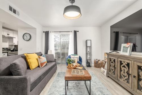 a living room with a couch and a table at Cozy UF Condo - Near Shands UF VA on Archer Road ! in Gainesville