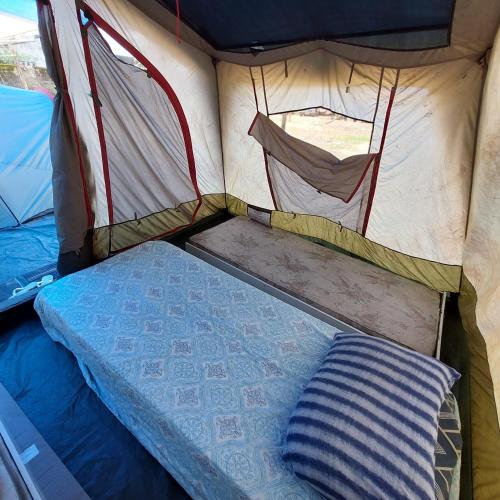 Giường trong phòng chung tại Camping Baque da Virada - Barraca com colchão