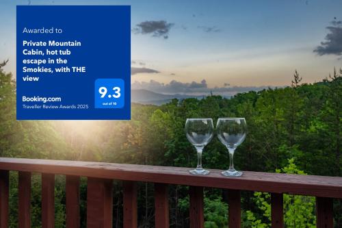 two wine glasses sitting on a balcony with the sunset at Private Mountain Cabin, hot tub escape in the Smokies, with THE view in Sevierville