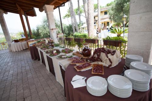 a long table with plates of food on it at Villa Del Colle in Monte San Giovanni Campano