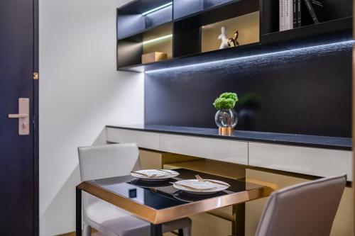 a small dining room with a table and chairs at CitiGO Hotel Shenzhen Shekou Cruise Center Seaview Near Taizi Bay K11 in Shenzhen