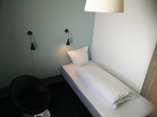 Ένα ή περισσότερα κρεβάτια σε δωμάτιο στο Motel X