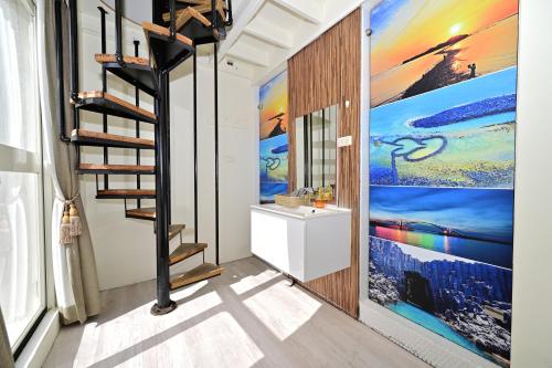 a bathroom with a staircase and a painting on the wall at 波斯卡朵親子城堡渡假民宿 in Magong