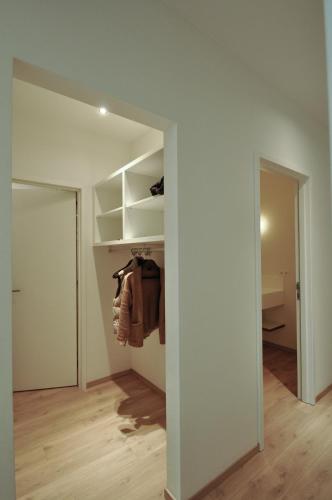 an empty room with a closet and a hallway at Cadix 35 in Antwerp