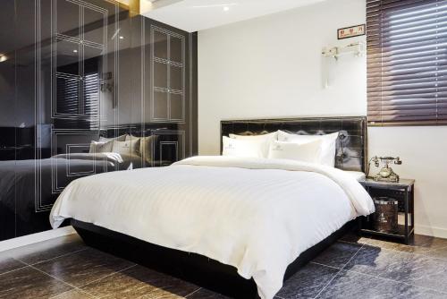 Ein Bett oder Betten in einem Zimmer der Unterkunft Hotel The Class
