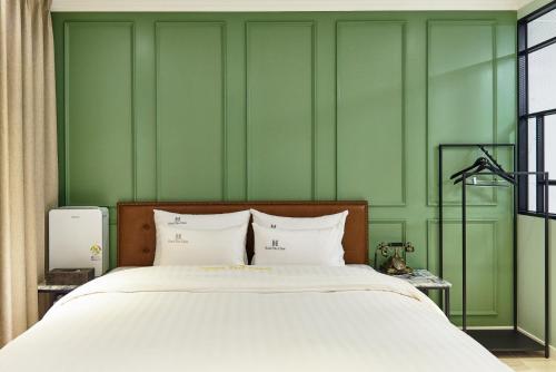 Ein Bett oder Betten in einem Zimmer der Unterkunft Hotel The Class