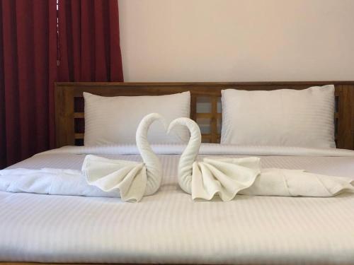 Ένα ή περισσότερα κρεβάτια σε δωμάτιο στο Villa Bella Hotels
