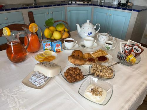 a table with a bunch of breakfast foods on it at Torre Archirafi Resort in Riposto