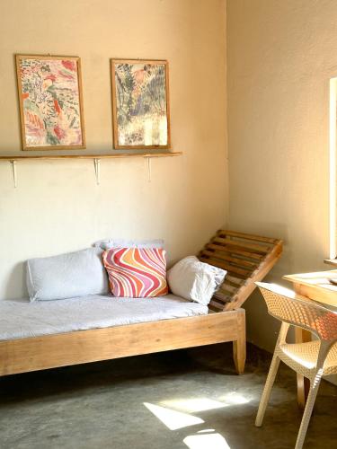 a room with a bed with two pillows on it at Villa Arugam Bay in Arugam Bay