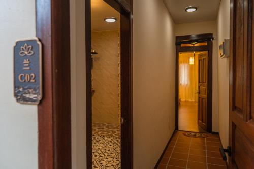 a hallway with a door leading into a room at Penang Story LINN House in George Town