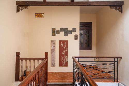 a room with a staircase and two doors at Penang Story LINN House in George Town