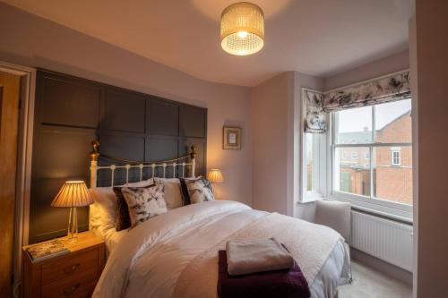 Ένα ή περισσότερα κρεβάτια σε δωμάτιο στο Refurbished Victorian house