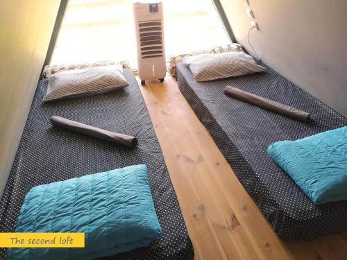 a group of pillows sitting on the floor of a room at DREAM house by the sea in Epanomi