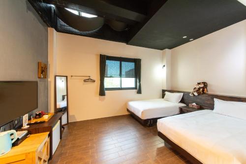 Postel nebo postele na pokoji v ubytování Ting Shuan B B&B