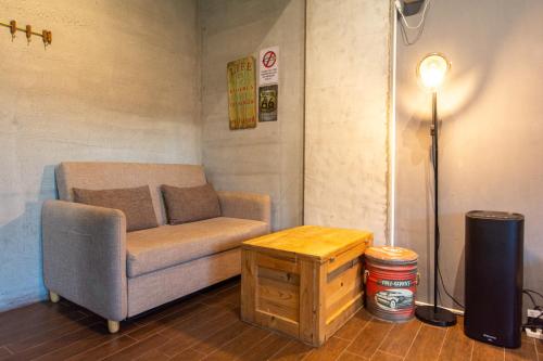 a living room with a couch and a table at Ting Shuan B B&B in Suao