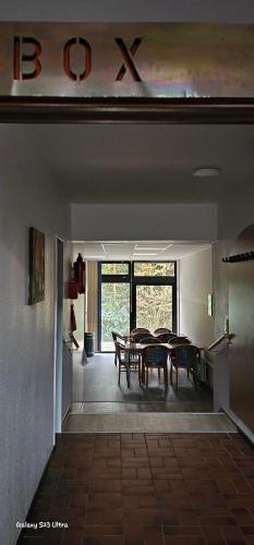 a dining room with a table and chairs in it at Aparthotel Höper in Oyten
