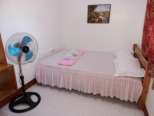 Postel nebo postele na pokoji v ubytování Kennie's Homestay