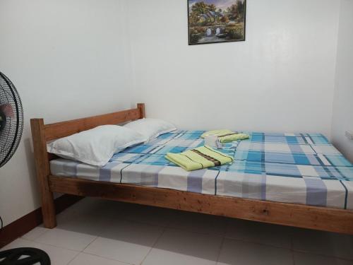 Postel nebo postele na pokoji v ubytování Kennie's Homestay