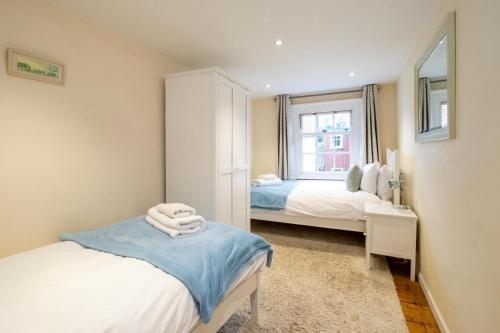 Katil atau katil-katil dalam bilik di Emeny Cottage - Aldeburgh Coastal Cottages