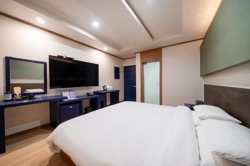 Ένα ή περισσότερα κρεβάτια σε δωμάτιο στο Lounge Seoul