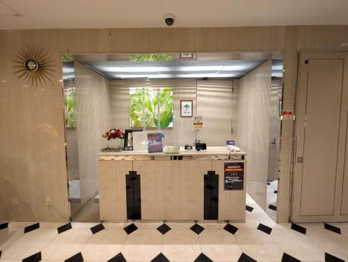 a lobby with a counter in a building at Hotel First (Adult Only) in Ikeda