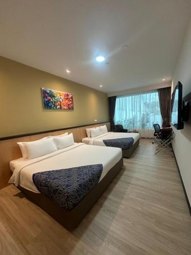 Postel nebo postele na pokoji v ubytování Hotel 7 Suria