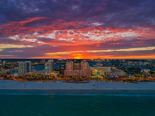 a view of a city at sunset with the ocean at Hyatt Regency Clearwater Beach Resort & Spa in Clearwater Beach