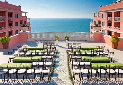 a balcony with a bunch of chairs and the ocean at Hyatt Regency Clearwater Beach Resort & Spa in Clearwater Beach