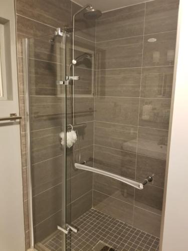 a shower with a glass door in a bathroom at Large Private Room Near Meta & Tech Hubs in Menlo Park
