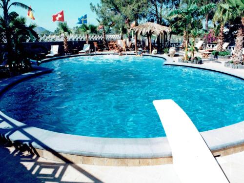 a large pool with blue water in a resort at Hotel Al Togo Fitness & Relax in Vulcano