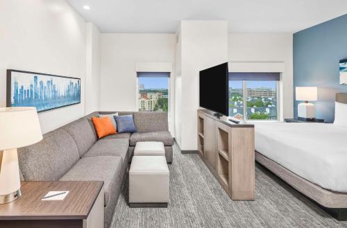 a living room with a couch and a bed at Hyatt House Houston Medical Center in Houston