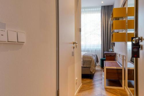 Cama o camas de una habitación en Vienna House Easy by Wyndham Hamburg Bergedorf